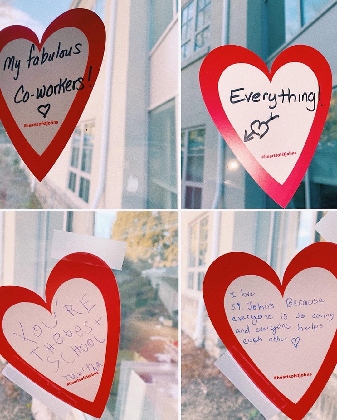 Hearts taped on a window with comments about what people love about St. John's